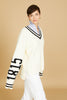 oversized v neck sweater, exaggerated long sleeve, cream cable knit, cream color with black accents, high-low hem length 