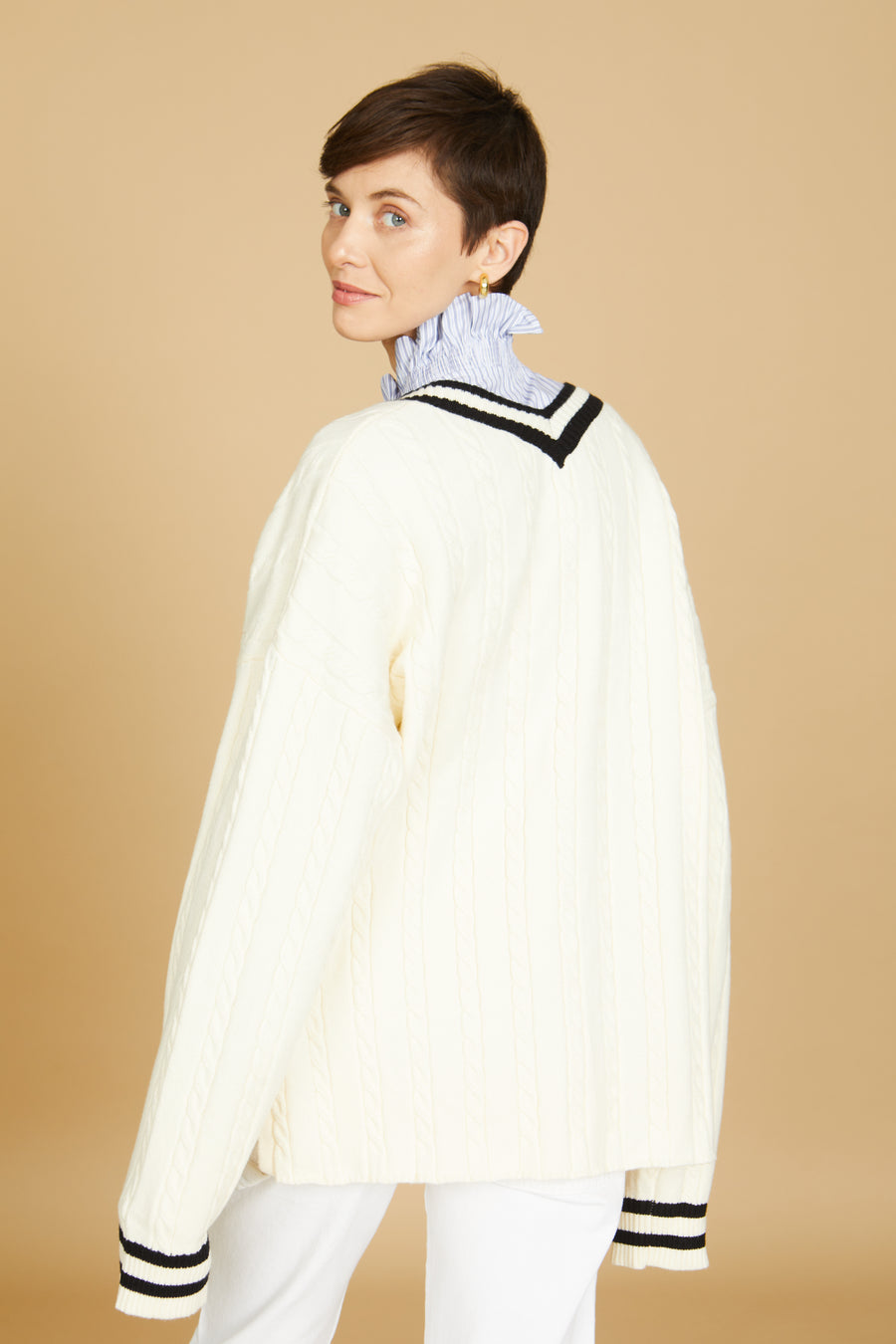 No Srcipt image - Images of 3 of 7 oversized v neck sweater, exaggerated long sleeve, cream cable knit, cream color with black accents, high-low hem length